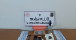 Jandarma baskınıyla ele geçirilen uyuşturucu, silah